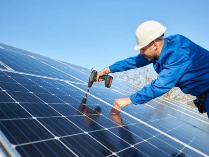 Solar panels being fitted to a pitched roof